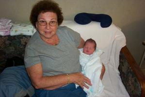 Grandma takes her turn at holding baby Rylan